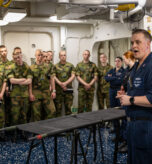 NORFOLK, Va. (April 29, 2025) Hospital Corpsman 1st Class Cole Tinklenberg from Grand Rapids, Michigan, assigned to the Wasp-class amphibious assault ship USS Iwo Jima (LHD 7) presents the ship’s medical spaces to His Majesty The King’s Guard 3rd Company from Norway during an in-port tour. Music and Drill Troops of the 3rd Guard’s Company, His Majesty the King's Guard, is the ceremonial and representational unit for the Norwegian Armed Forces. This professional group is renowned for its musical excellence and plays a key role in national events, state ceremonies, and official functions, displaying the traditions and heritage of Norway. Iwo Jima is the flagship of the Iwo Jima Amphibious Readiness Group, a force uniquely positioned to deter aggression, project power through presence abroad, and execute contingency missions with its integrated Marine Corps team in support of U.S. strategic interest. (U.S. Navy photo by Mass Communication Specialist 1st Class Erickson B. Magno)