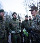 U.S. Marine Corps 1st Lt. Gillian Eby, a logistics officer, and native of Baltimore, gives U.S. Marines and Finnish soldiers a safety brief before a joint long-range convoy in preparation for Exercise Freezing Winds 24 in Dragsvik, Finland, Nov. 19, 2024. Freezing Winds is an annual Finnish-led maritime exercise involving U.S. Marines assigned to Marine Rotational Force – Europe and serves as a venue to increase Finnish Naval readiness and interoperability between NATO partners and allies in and around the Baltic Sea. (U.S. Marine Corps photo by Cpl. Meshaq Hylton)