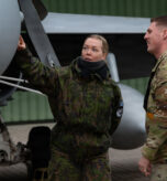 A Finnish Air Force member and U.S. Air Force Staff Sgt. Martin Stiller, 493rd Fighter Generation Squadron tactical aircraft maintenance specialist, discuss elements of a Finnish Air Force F/A-18C Hornet aircraft assigned to the Karelia Air Wing at Ørland Air Force Station, Norway, March 13, 2026. Training as one unified, lethal force during Exercise Cold Response 26 ensured NATO Allies and partners were prepared to safeguard and protect critical infrastructure important to both European and American interests. (U.S. Air Force photo by Staff. Sgt. Elizabeth Davis)