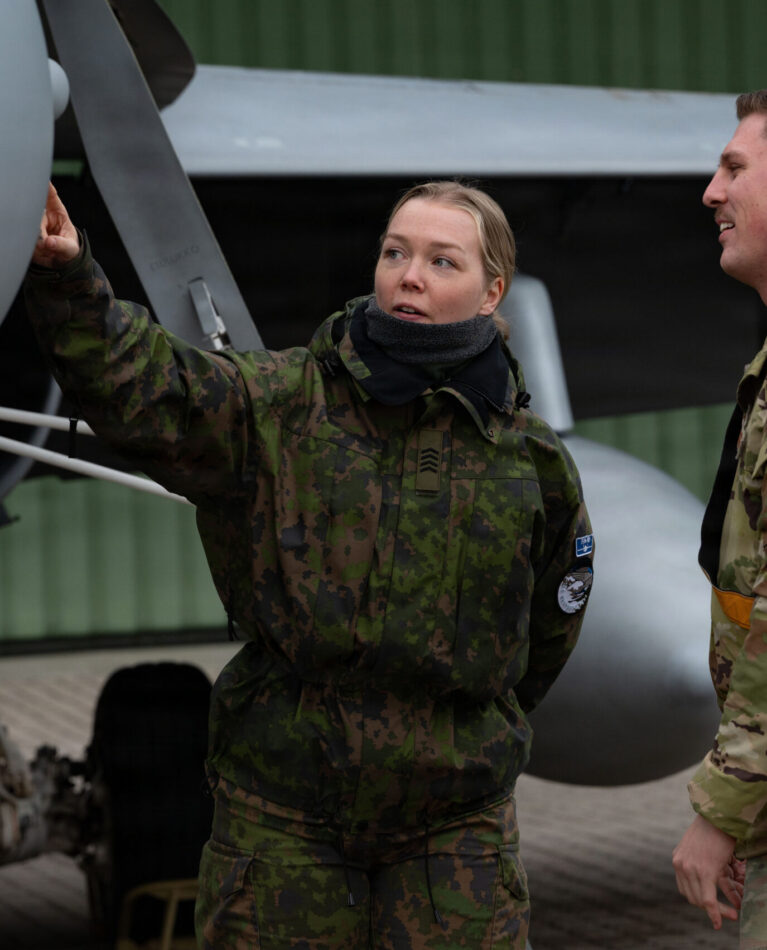 A Finnish Air Force member and U.S. Air Force Staff Sgt. Martin Stiller, 493rd Fighter Generation Squadron tactical aircraft maintenance specialist, discuss elements of a Finnish Air Force F/A-18C Hornet aircraft assigned to the Karelia Air Wing at Ørland Air Force Station, Norway, March 13, 2026. Training as one unified, lethal force during Exercise Cold Response 26 ensured NATO Allies and partners were prepared to safeguard and protect critical infrastructure important to both European and American interests. (U.S. Air Force photo by Staff. Sgt. Elizabeth Davis)
