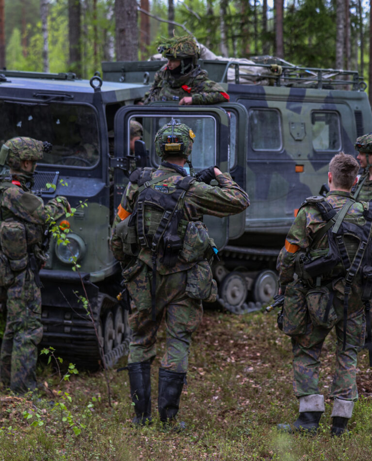 A group of Finnish soldiers talk amongst one another near a Finnish Sisu NA-110 tracked vehicle on May 27, 2026 at Vuosanka Training Area, Finland. From April 27 to May 31, 2026 U.S. and Allied forces will exercise NATO’s Eastern Flank Deterrence Initiative, demonstrating NATO’s ability to fight and win on the modern battlefield. Nearly 15,000 troops from eleven nations will train across the High North, Baltic region, and Poland, executing rapid maneuvers, air defense, counter-drone operations, and cyber defense to validate NATO’s regional defense plans in real time. This series of linked exercises, including Saber Strike, Immediate Response, and Swift Response, turns investment into capability. Soldiers integrate unmanned systems, AI-enabled command and control, and live data networks to move faster, decide faster, and fight more effectively across all domains. Sword 26 demonstrates how U.S. Army Europe and Africa drives transformation at scale while strengthening deterrence. Together with our Allies, we are building a unified, lethal force ready to defend NATO territory and respond to any threat. (U.S. Army Reserve photo by 1st Sgt. Austin Berner)