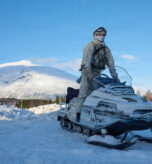 Norwegian army service member rides a snowmobile in Setermoen, Norway, March 12, 2026. The service member was present during a capability demonstration between Norway, the United States, France, and Germany for exercise Cold Response 26. A key component of NATO's enhanced vigilance activity Arctic Sentry, exercise Cold Response 26 is a Norwegian-led winter military exercise designed to enhance collective defense capabilities and ensure U.S. readiness to rapidly deploy and seamlessly operate alongside NATO Allies in challenging arctic conditions. (U.S. Marine Corps photo by Cpl. Garrett Gillespie)