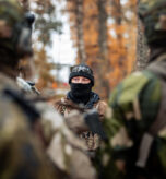 A Green Beret with U.S. Army 10th Special Forces Group (Airborne) speaks to Swedish K3 Rangers, after conducting squad tactics during Adamant Serpent 26 in Karlsborg, Sweden, Oct. 20, 2025. Adamant Serpent 26 is a U.S. European Command-approved exercise conducted by U.S. Special Operations Command Europe to demonstrate U.S. Special Operations Forces’ and NATO Allies’ organic ability to execute synchronized rapid deployment in support of NATO operations. These capabilities demonstrate that the Alliance can decisively maneuver and gain advantage in a dynamic security environment. (U.S. Army photo by Staff Sgt. Reece Heck)