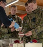 Finnish soldiers with the Nylands Brigade receive pieces of birthday cake during the U.S. Marine Corps 247th birthday celebration in Dragsvik, Finland, Nov. 10, 2022. U.S. Marines with Combat Logistics Battalion 6 (CLB-6), invited Finnish soldiers to participate in the U.S. Marine Corps 247th birthday celebration and cake cutting ceremony. (U.S. Marine Corps photo by Lance Cpl. Maxwell Cook)